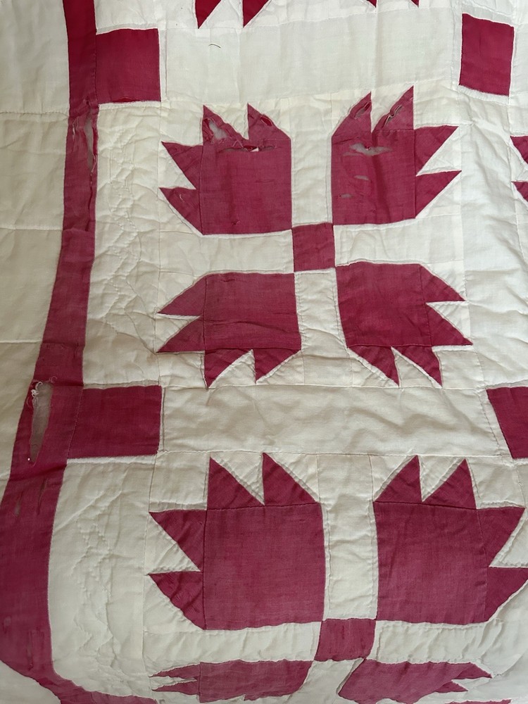Cutters handmade red and white "Bear Paw" pattern quilt.