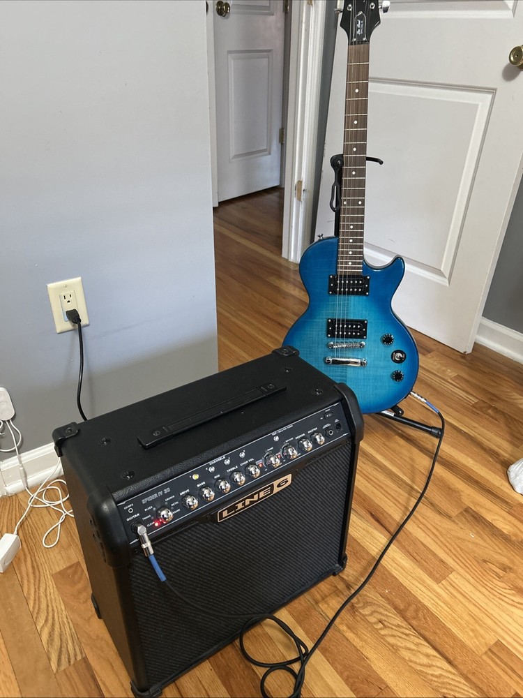 guitar, amp, and stand combo