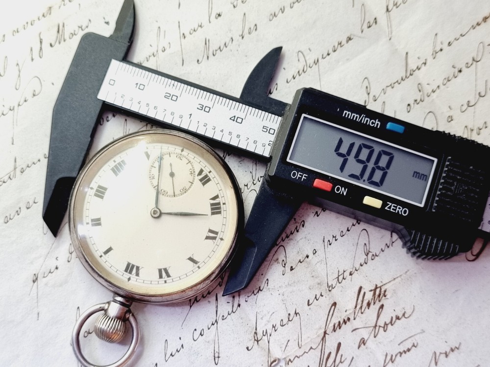 silver open face pocket watch