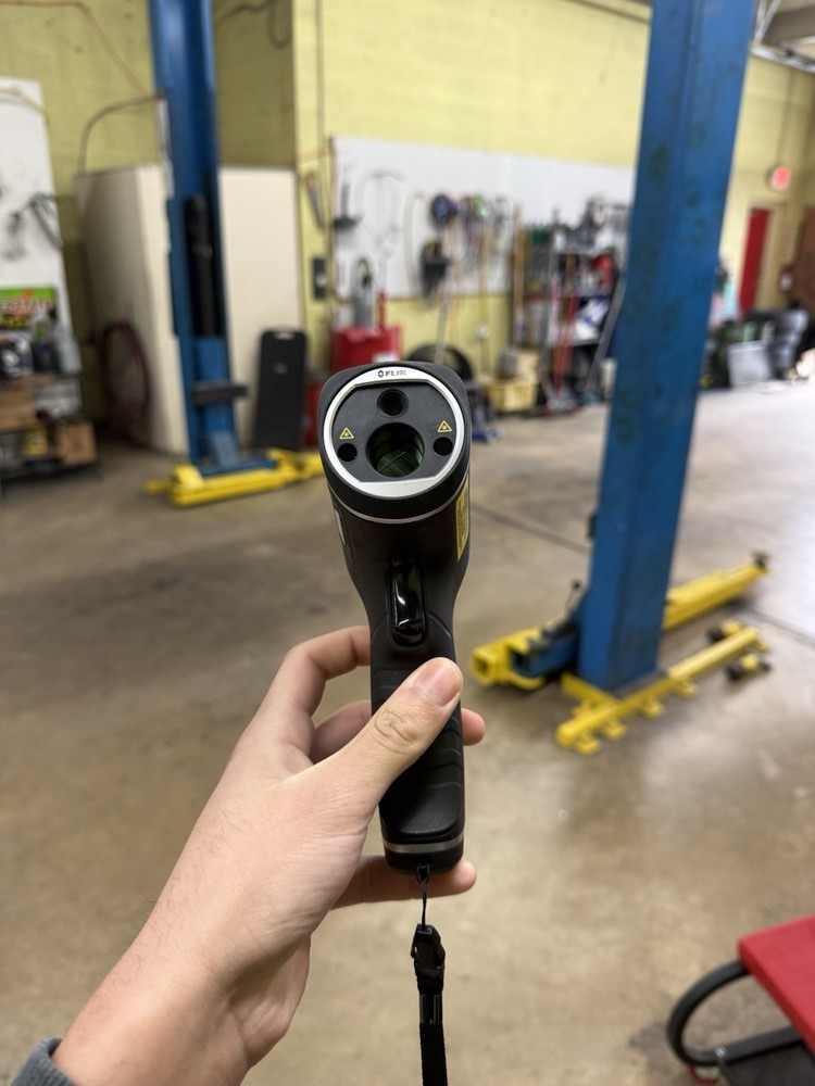 FLIR TG165 thermal camera, matte black with gray bezel.