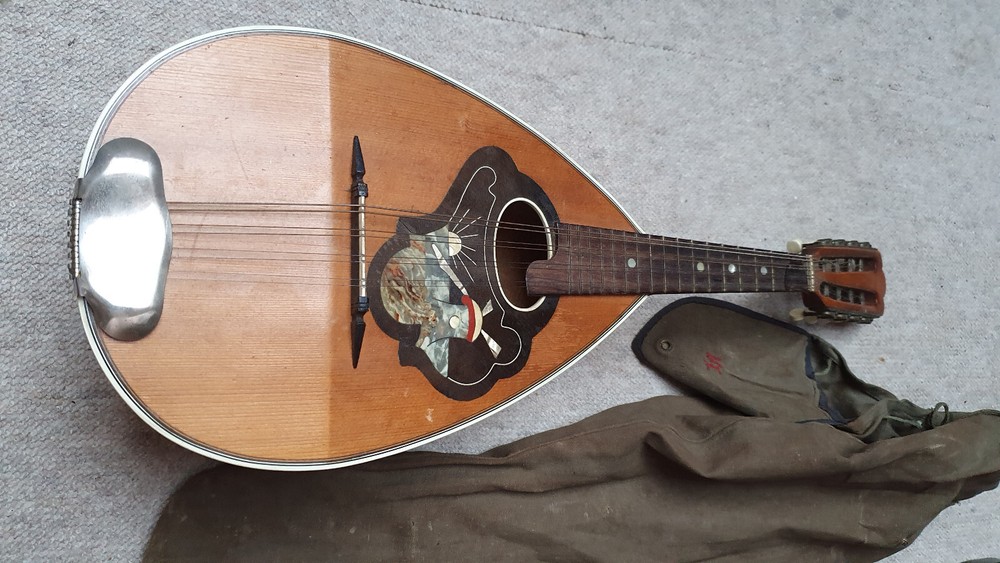 Nice old mandolin w.  a nicely inlayed windmil, needs repair