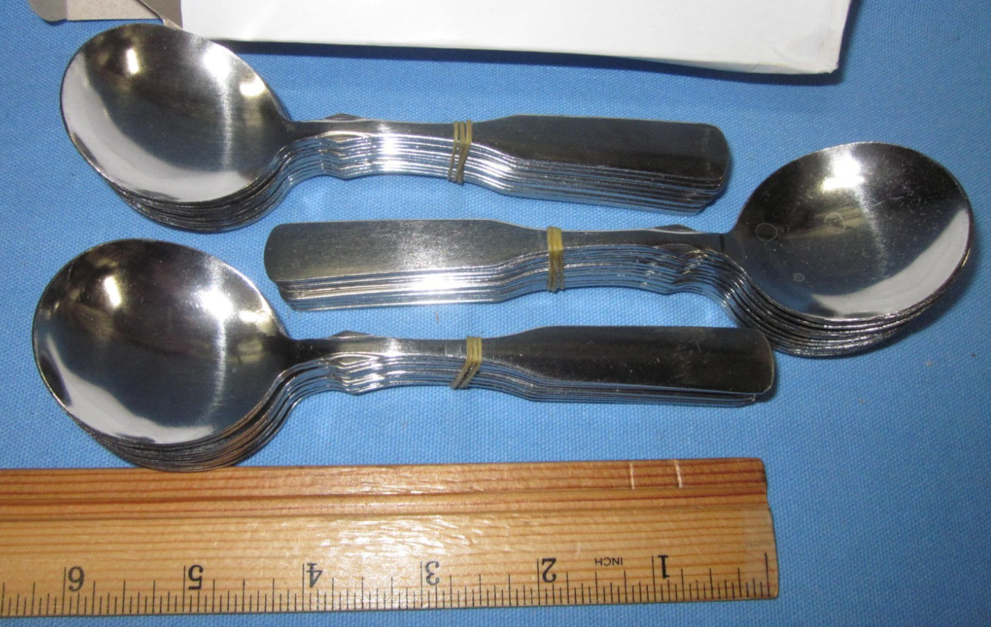 a Box of 36 Global LLC Olive Garden Bouillon Spoons