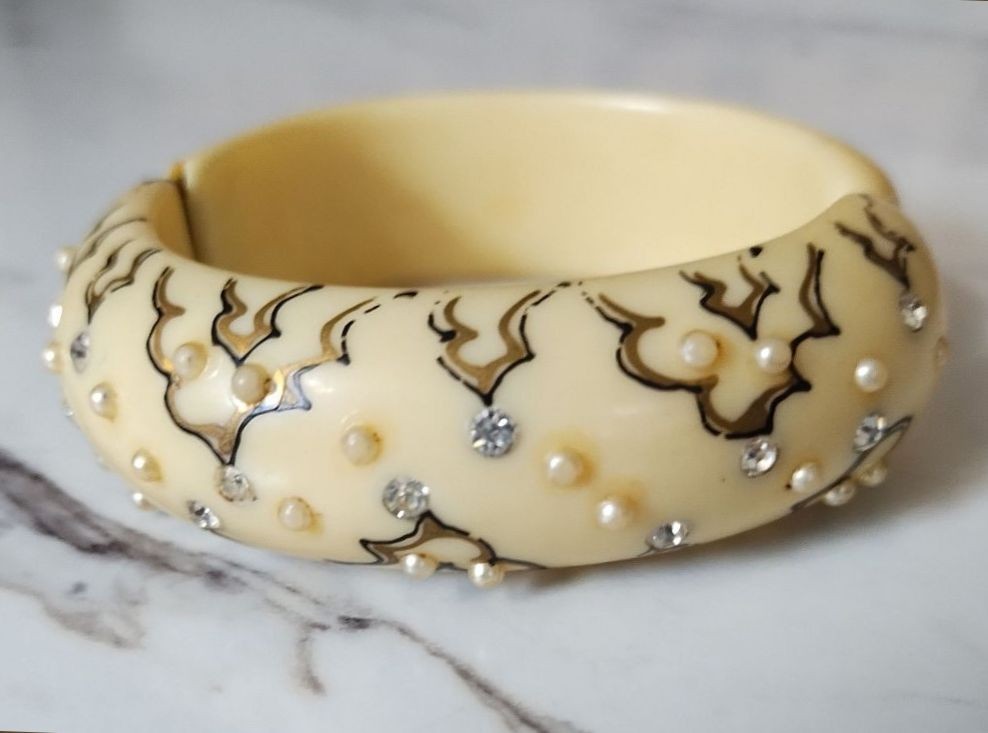 Mid century Thermoset plastic ivory clamper bracelet with rhinestones