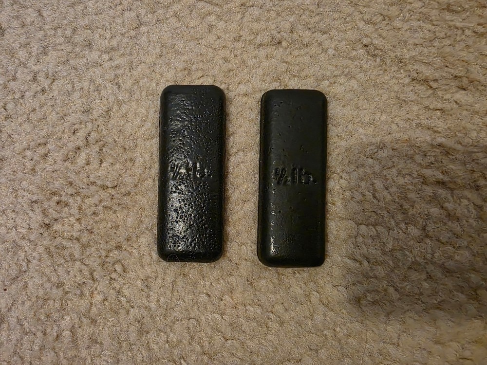 Two Black 1/2 Pound Weights