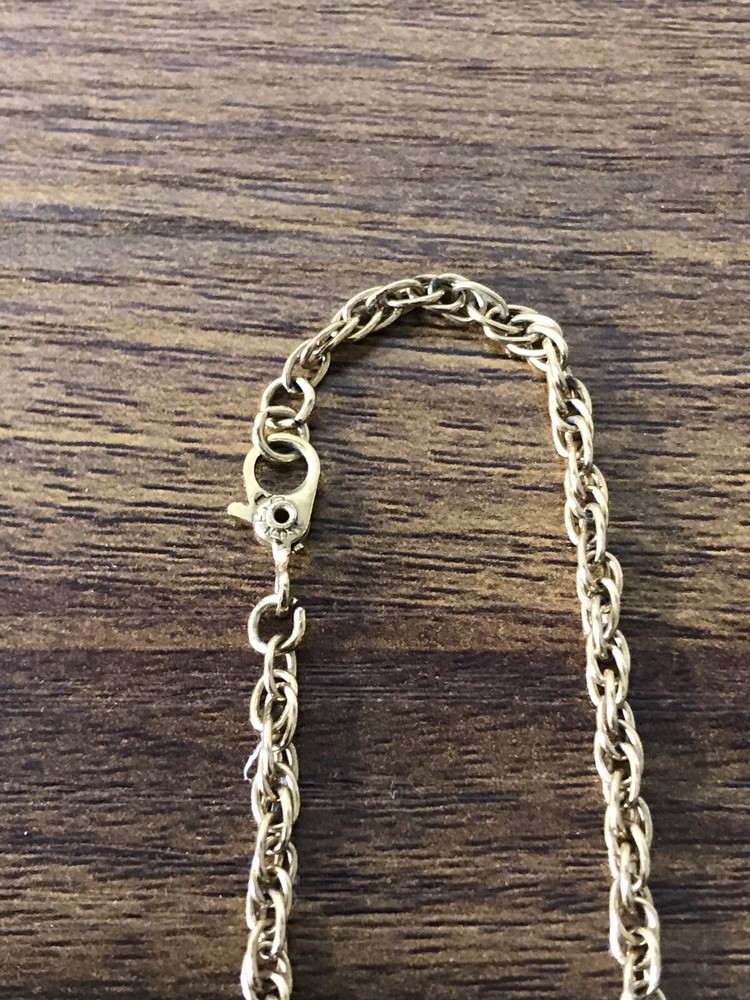 Monet Gold tone Necklace with round Pattern Pendant