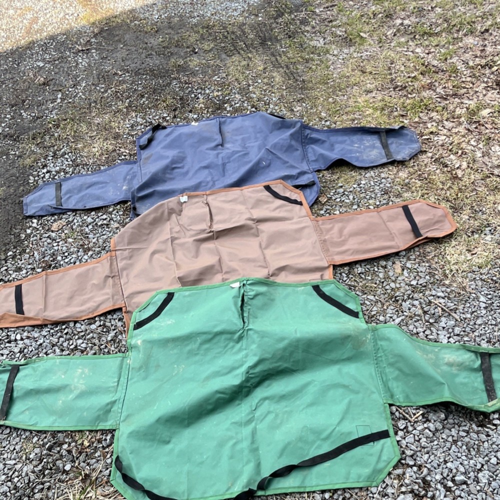 3 saddle covers. One new 2 used