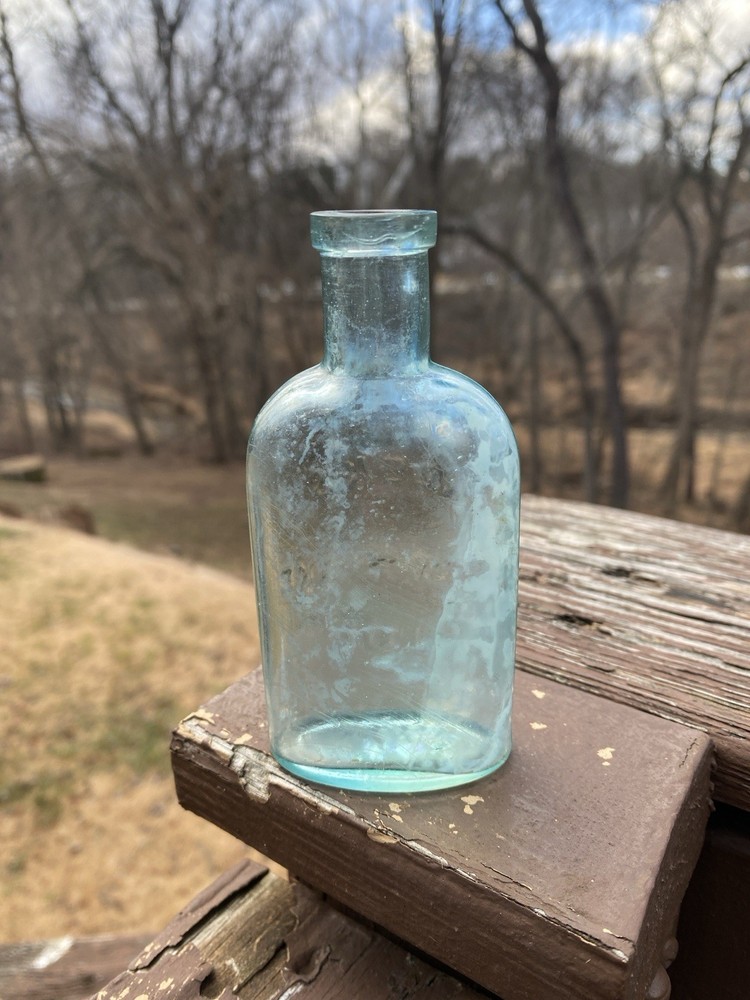 Week’s Snow Flake Blue Antique Bottle