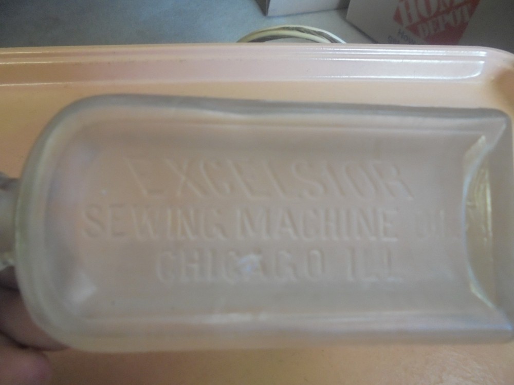 Vintage Embossed Bottle Excelsior Sewing Machine Oil triangular Shape