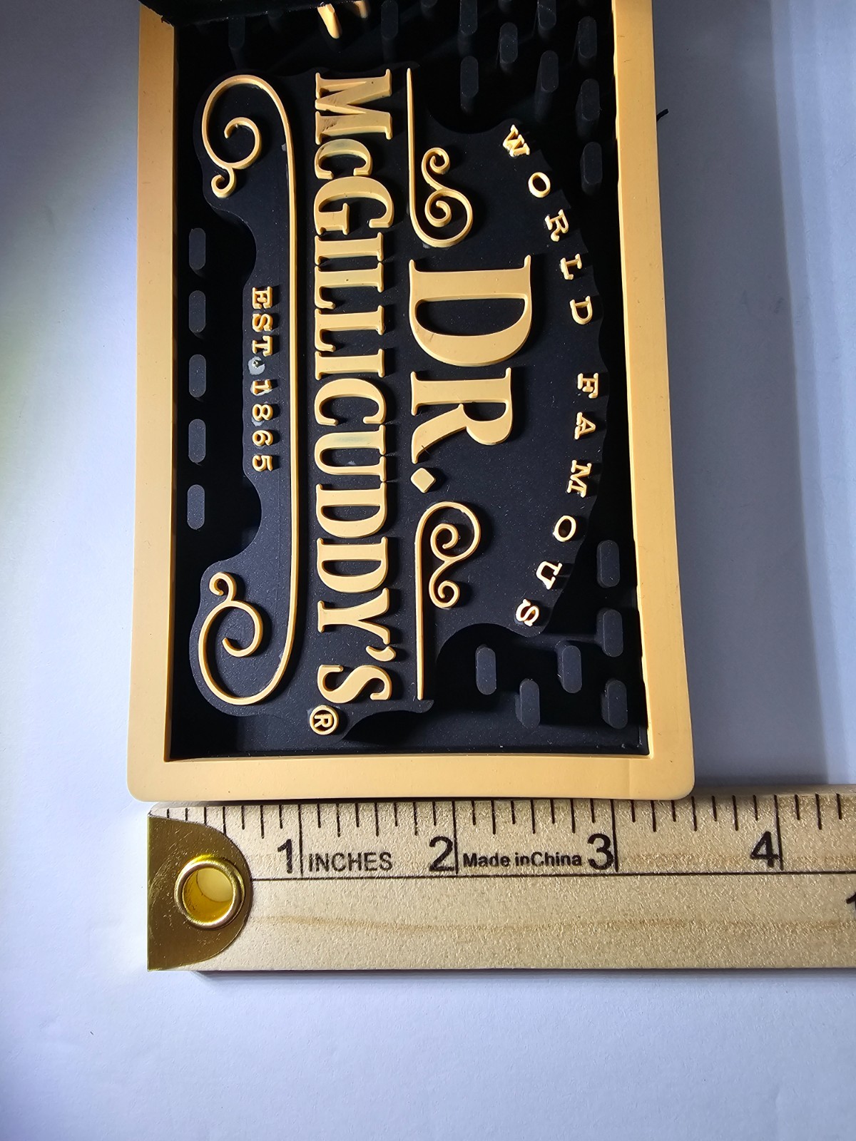 Dr. McGillicuddy's rubber bar mat featuring the brand name A.P. Mcgillicuddys