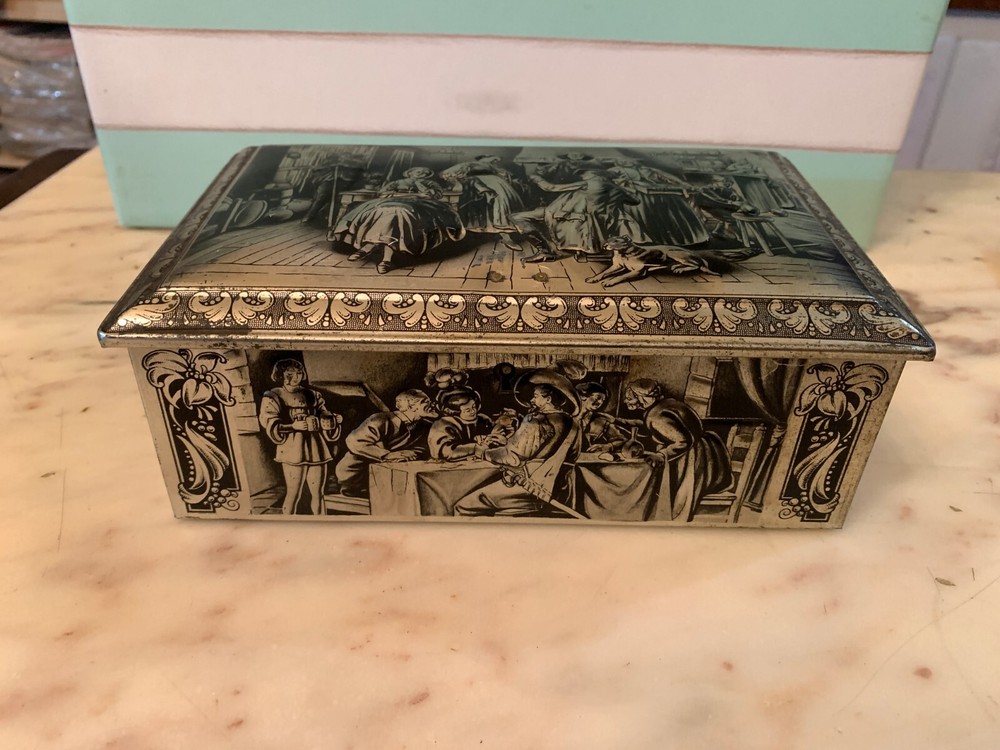 VINTAGE RUBENS EMBOSSED TIN BOX KEYLESS BOX
