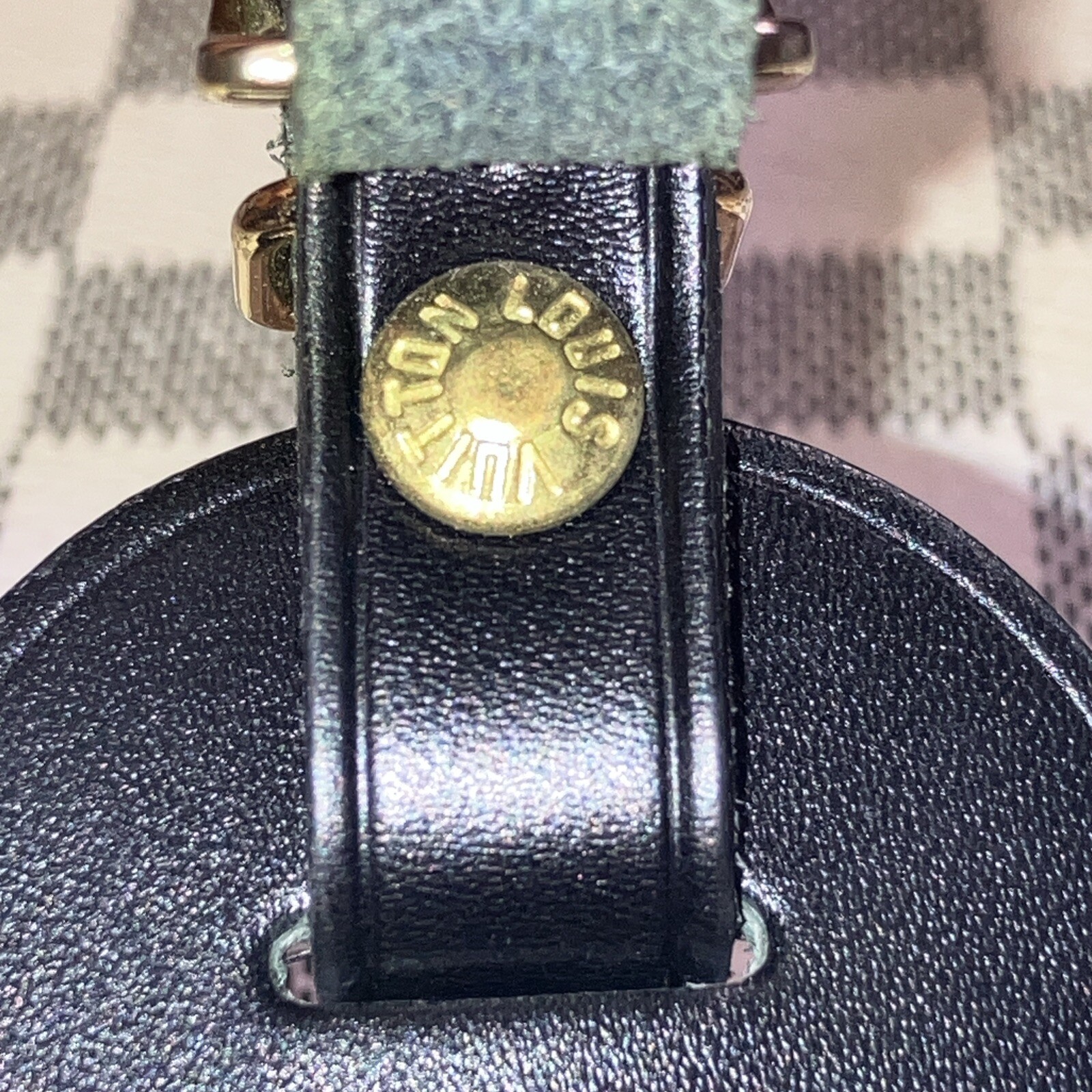 Authentic Louis Vuitton small Black W/ Gold Hardware name tag.