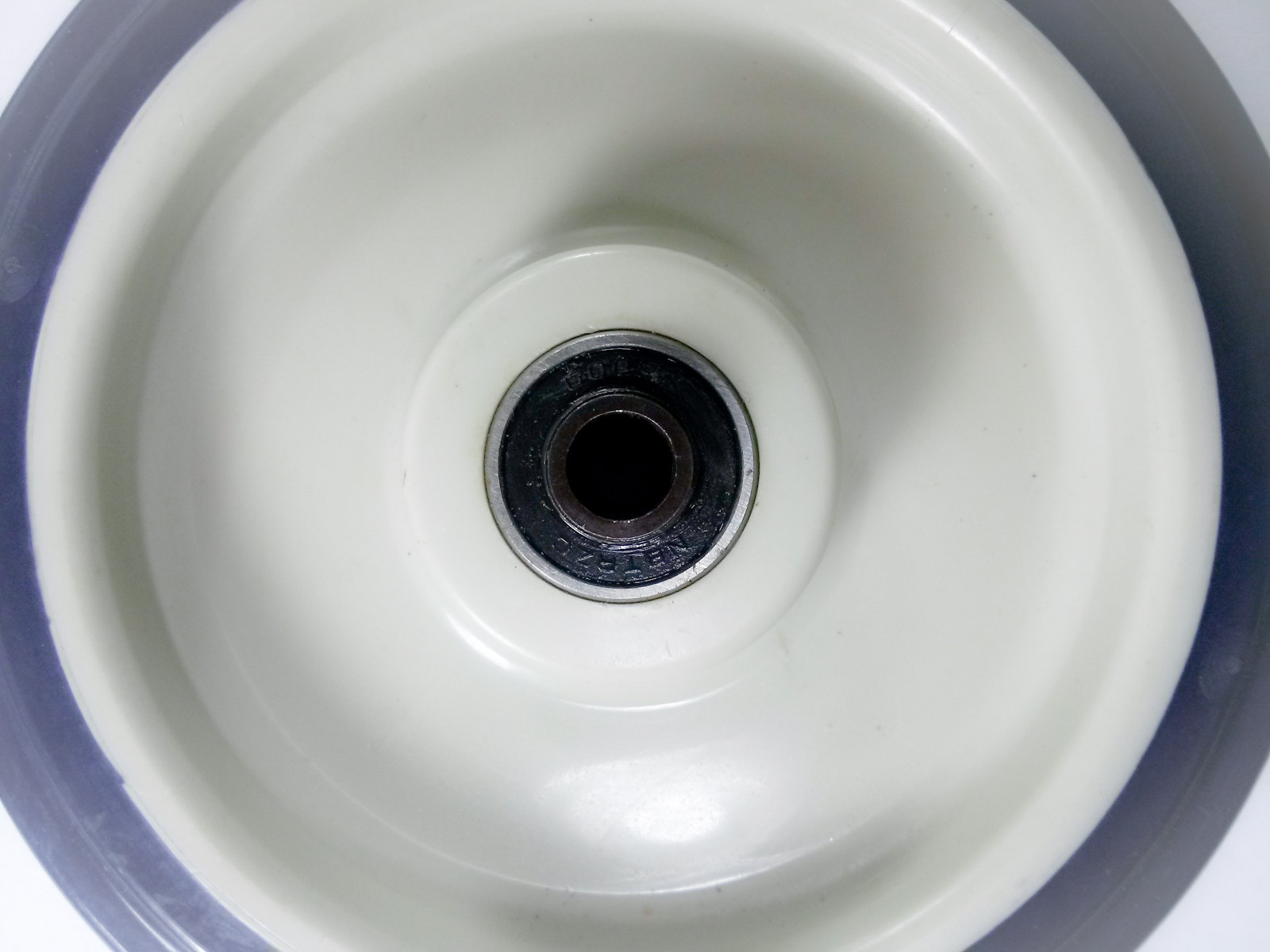 5" x 1-1/4" Polyurethane Shopping Cart Wheel with Axle and Nut (5/16") - 1 EA