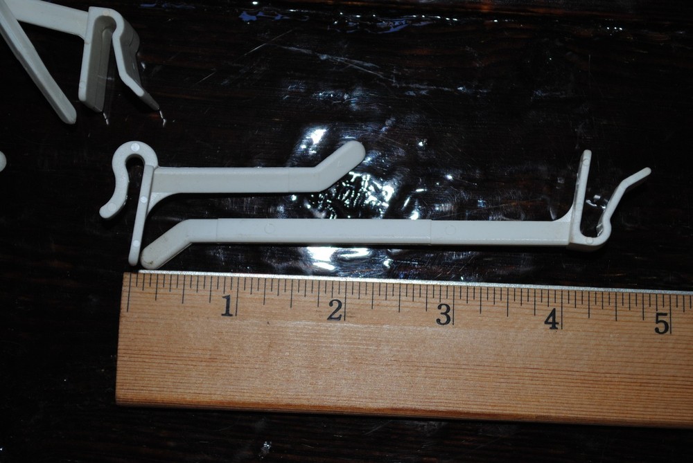 25 Plastic Snap Snap-On Peg Hook - 4" white cardboard counter wire rack display