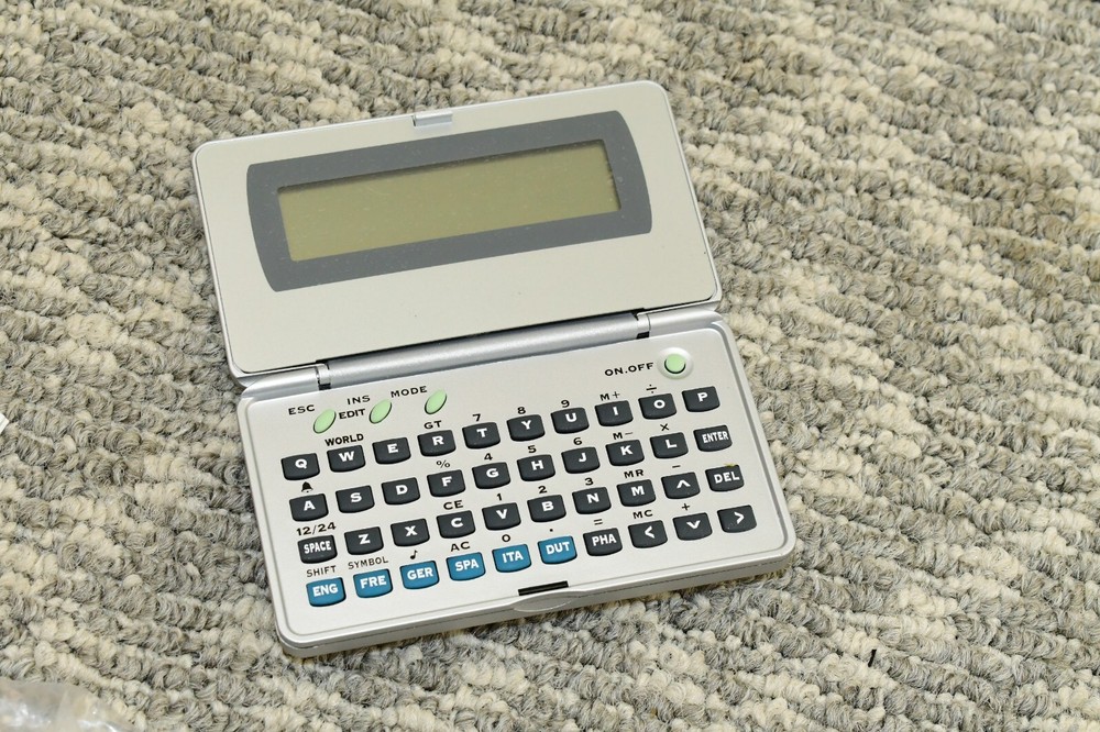 Generic Electronic Language Translator Handheld Computer - Needs New Batteries