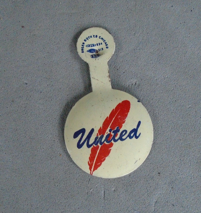 WWII Community Chest pin with arrow