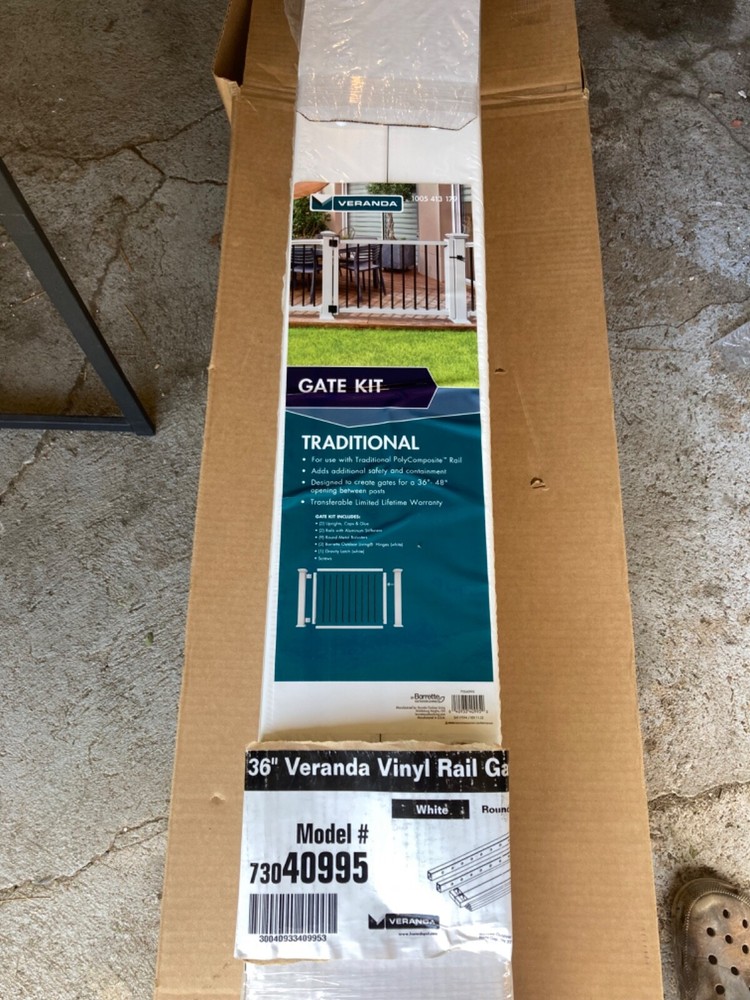 New white with black spindled Veranda gate post.