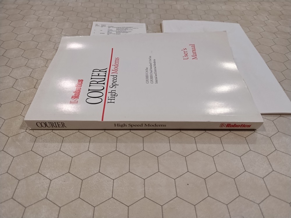 Courier Modem V.34 User's Manual/quick reference card, 1992-1994