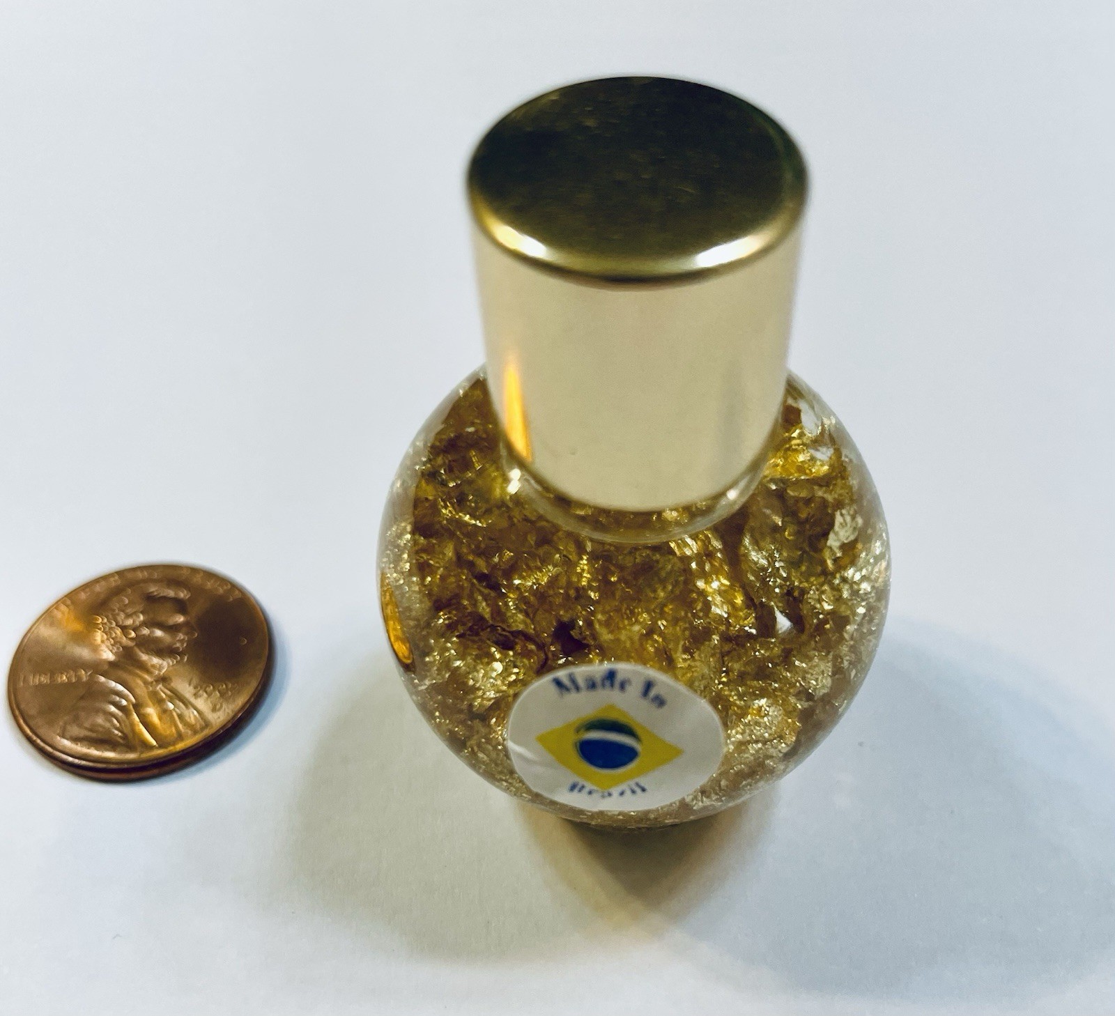 Pure Gold Leaf Flakes in a Sealed Bottle