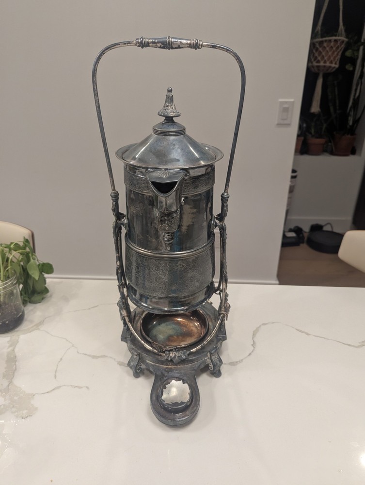 James W Tufts Silver Plated Tilting Water Pitcher