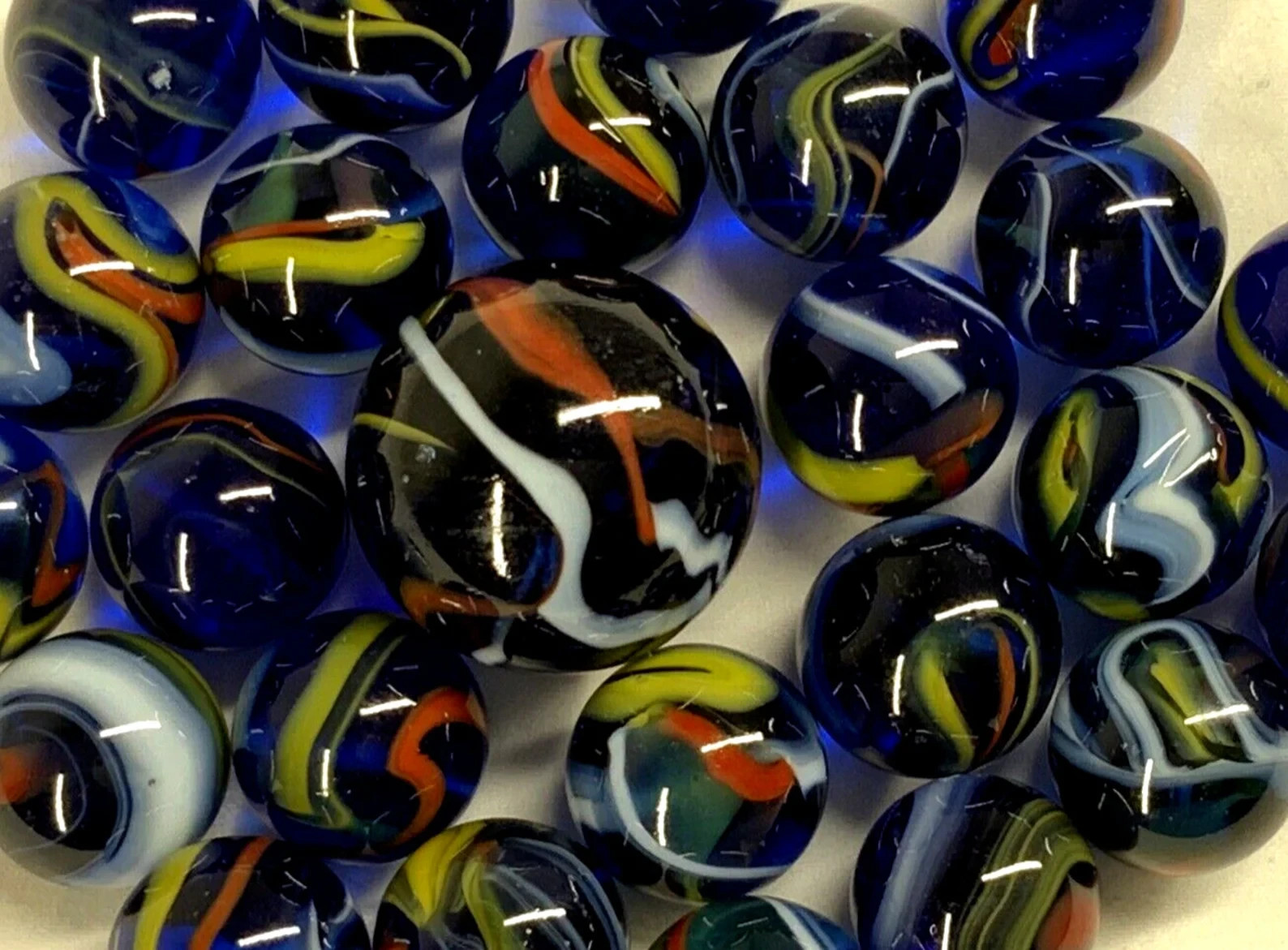 25 Glass Marbles ECLIPSE Translucent Blue Red/Yellow Swirl Pack Shooter