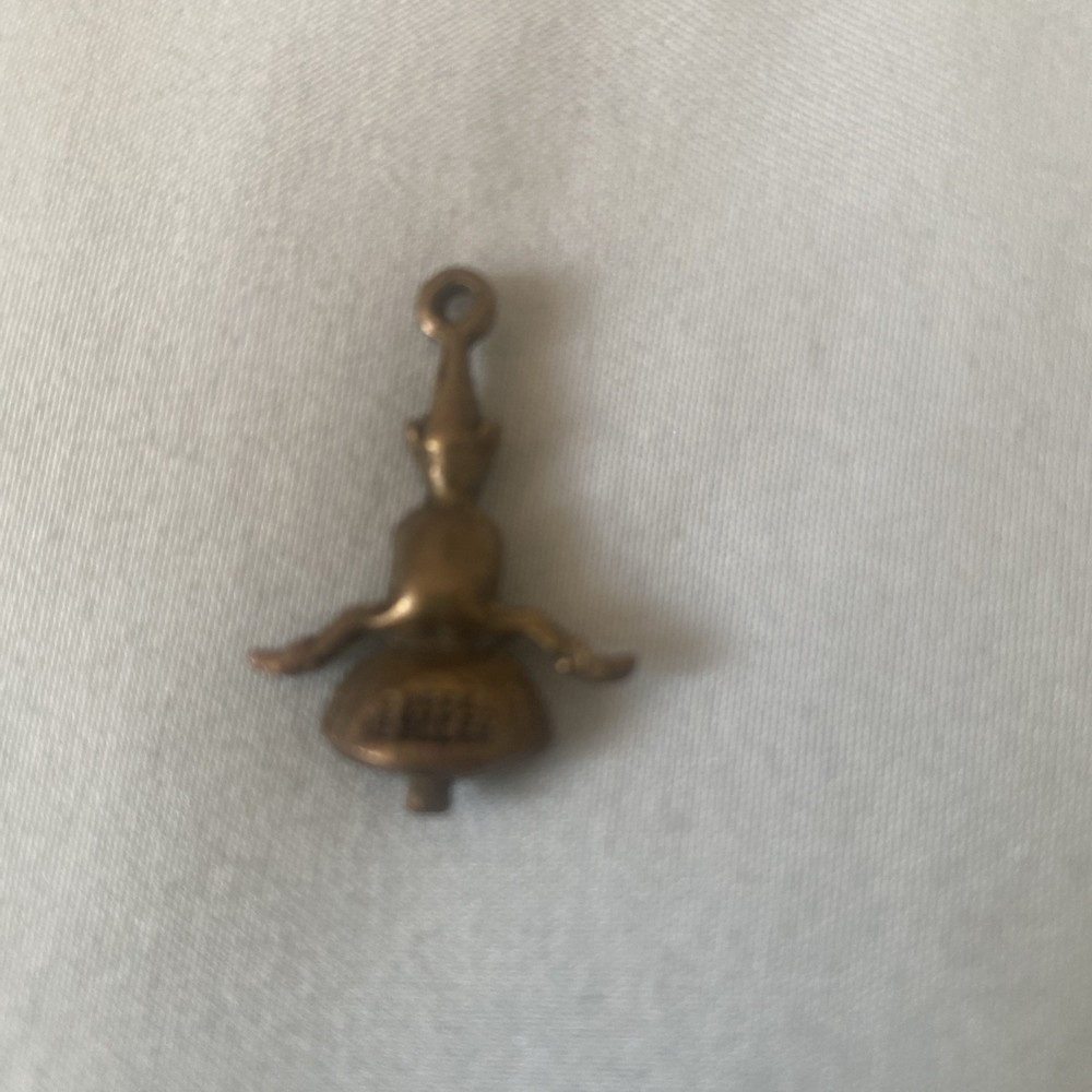 VINTAGE PIXIE ON TOAD STOOL lucky charm. Stamped.