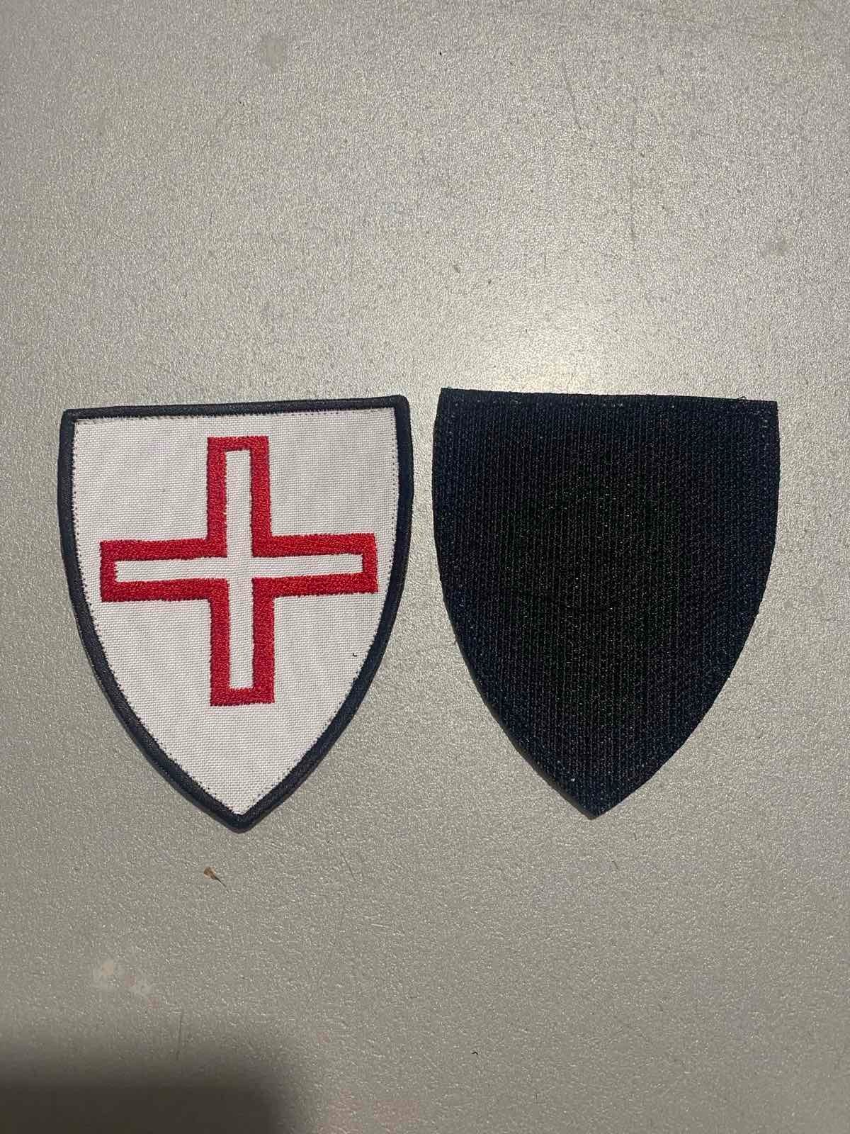 Chevron with the symbol of the Hospitallers of St. Thomas of Canterbury in Acre.