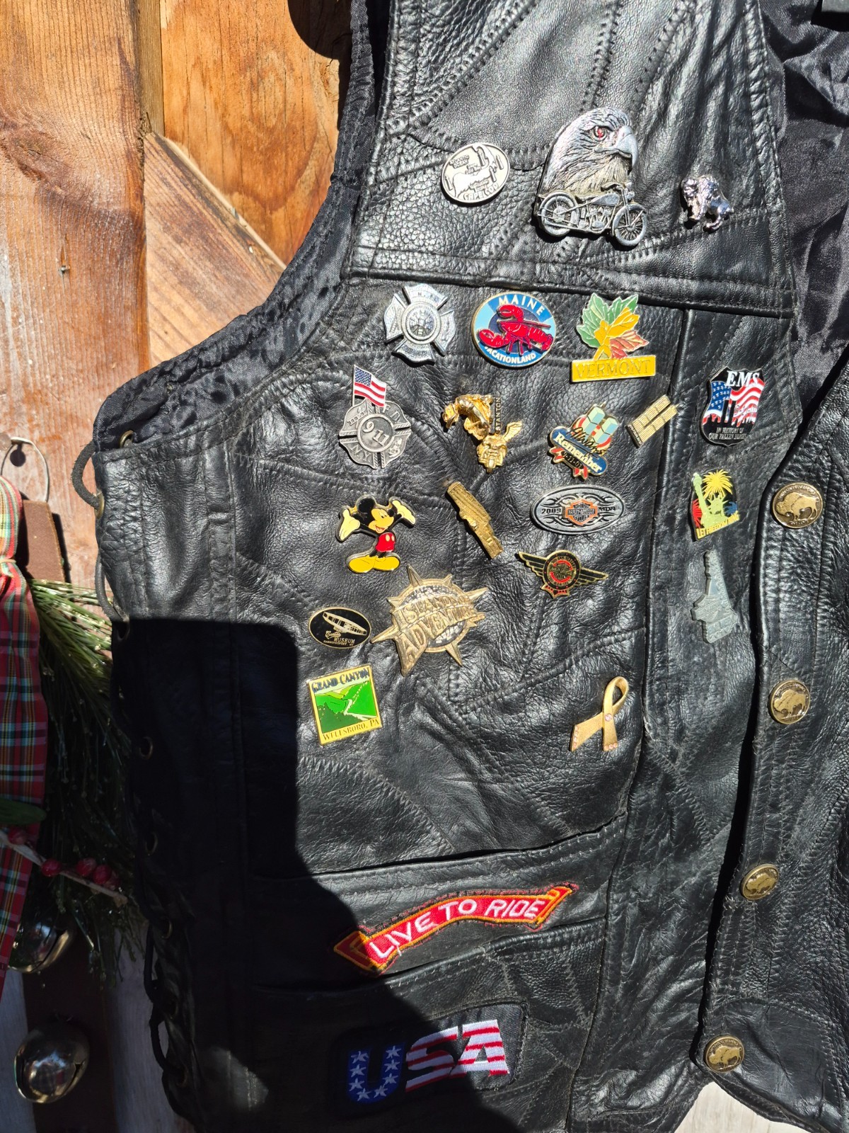 Vintage harley hog leather vest filled with pins and has patches 2xl