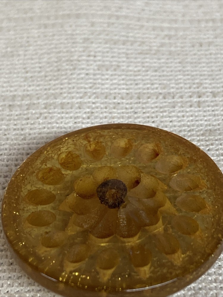 ANTIQUE CARVED FLORAL LUCITE BUTTON