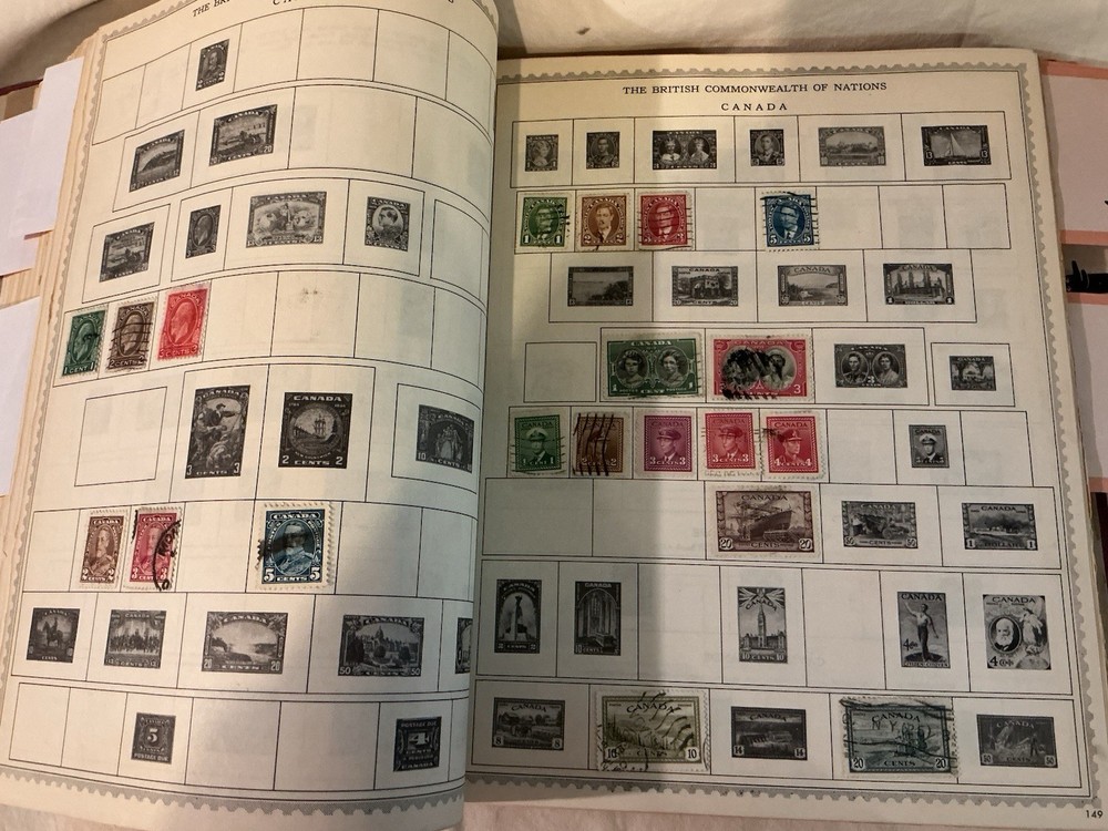 The New World Wide Postage Stamp Album with Over 775 Stamps See Photos
