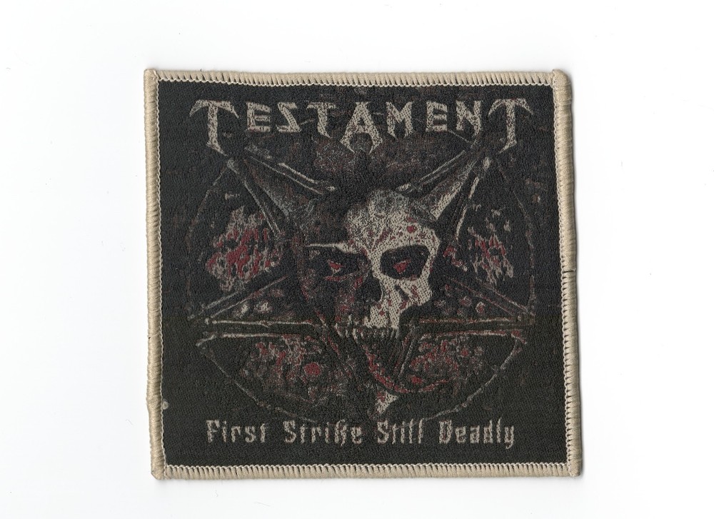 TESTAMENT,FIRST STRIKE STILL DEADLY, SEW ON BROWN BORDER WOVEN PATCH