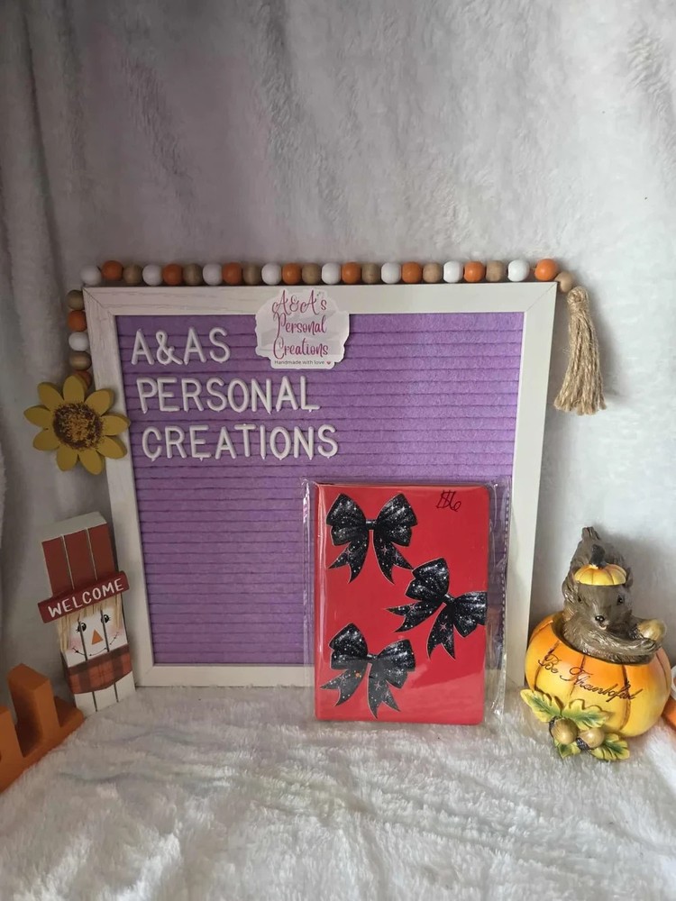 red notebook with black bows