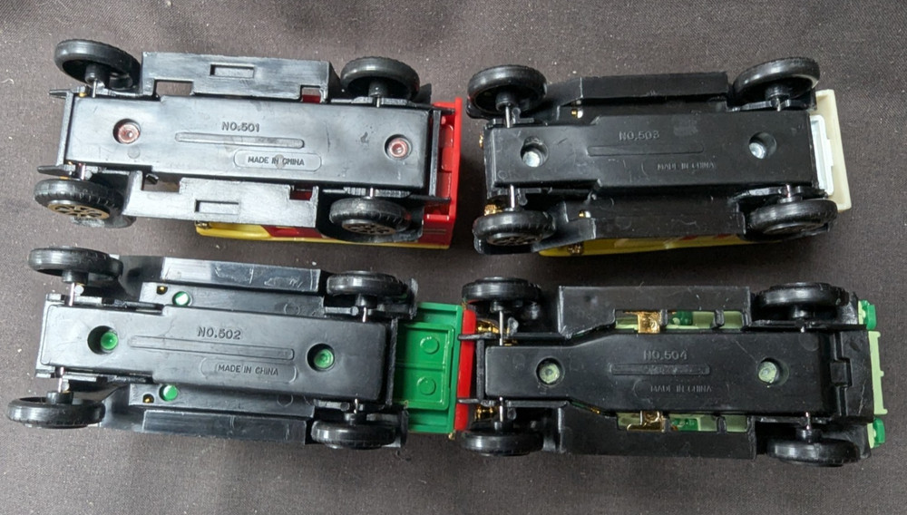 4 Die Cast Vans -