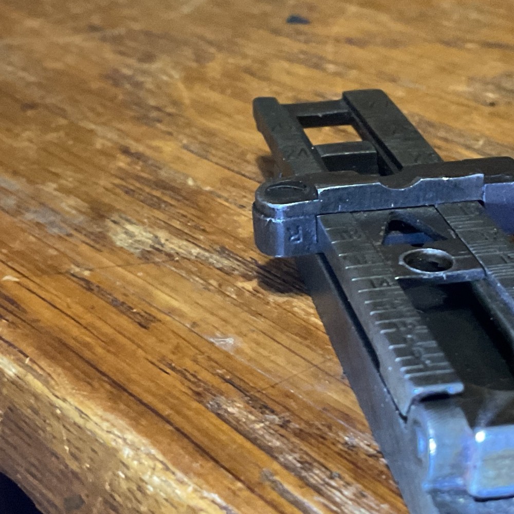 Remington 1903 sight base, leaf, slide, elevation, windage knobs marked R. 1 set