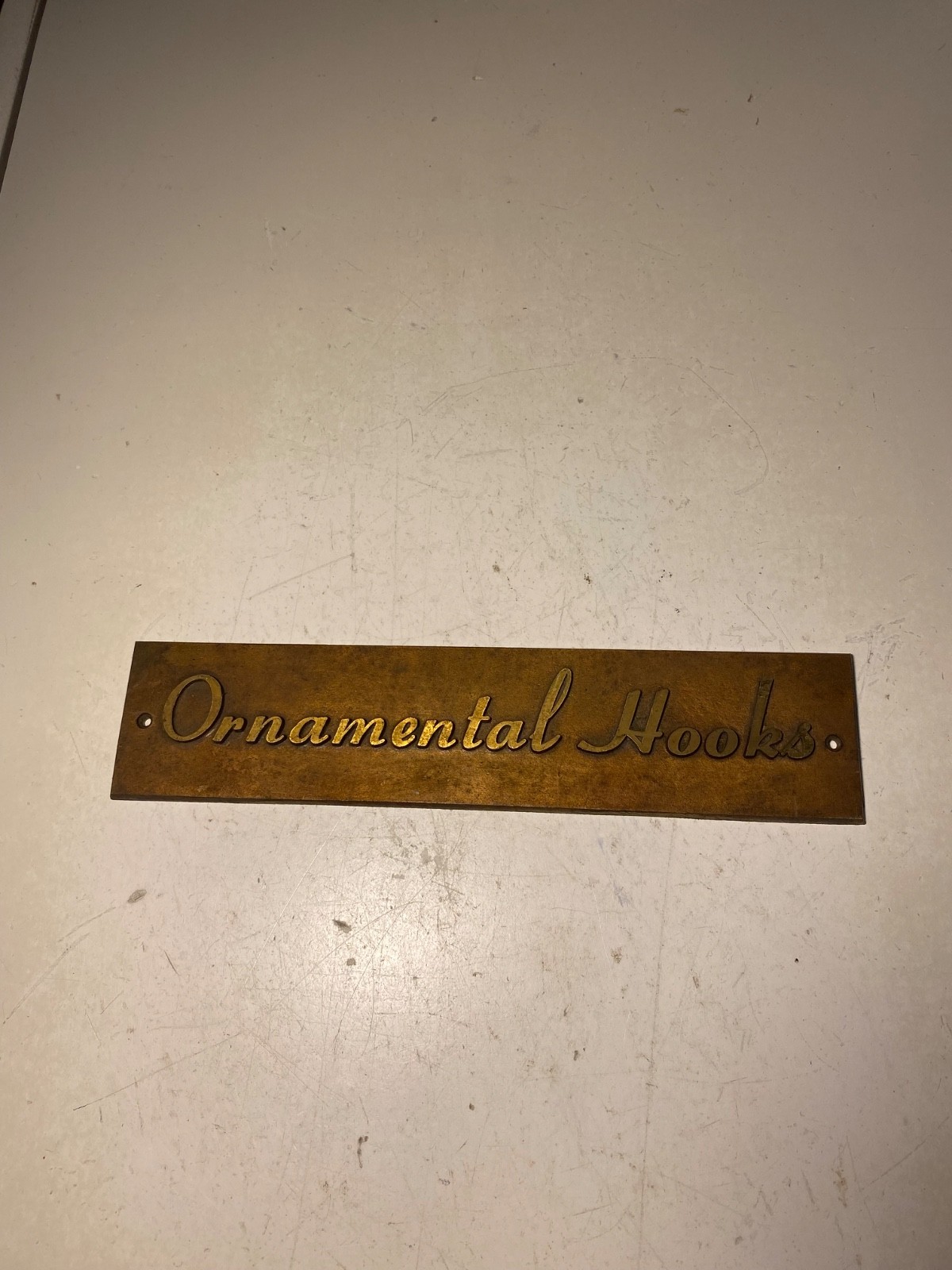 Vintage Metal Ornamental Hooks Sign Plaque
