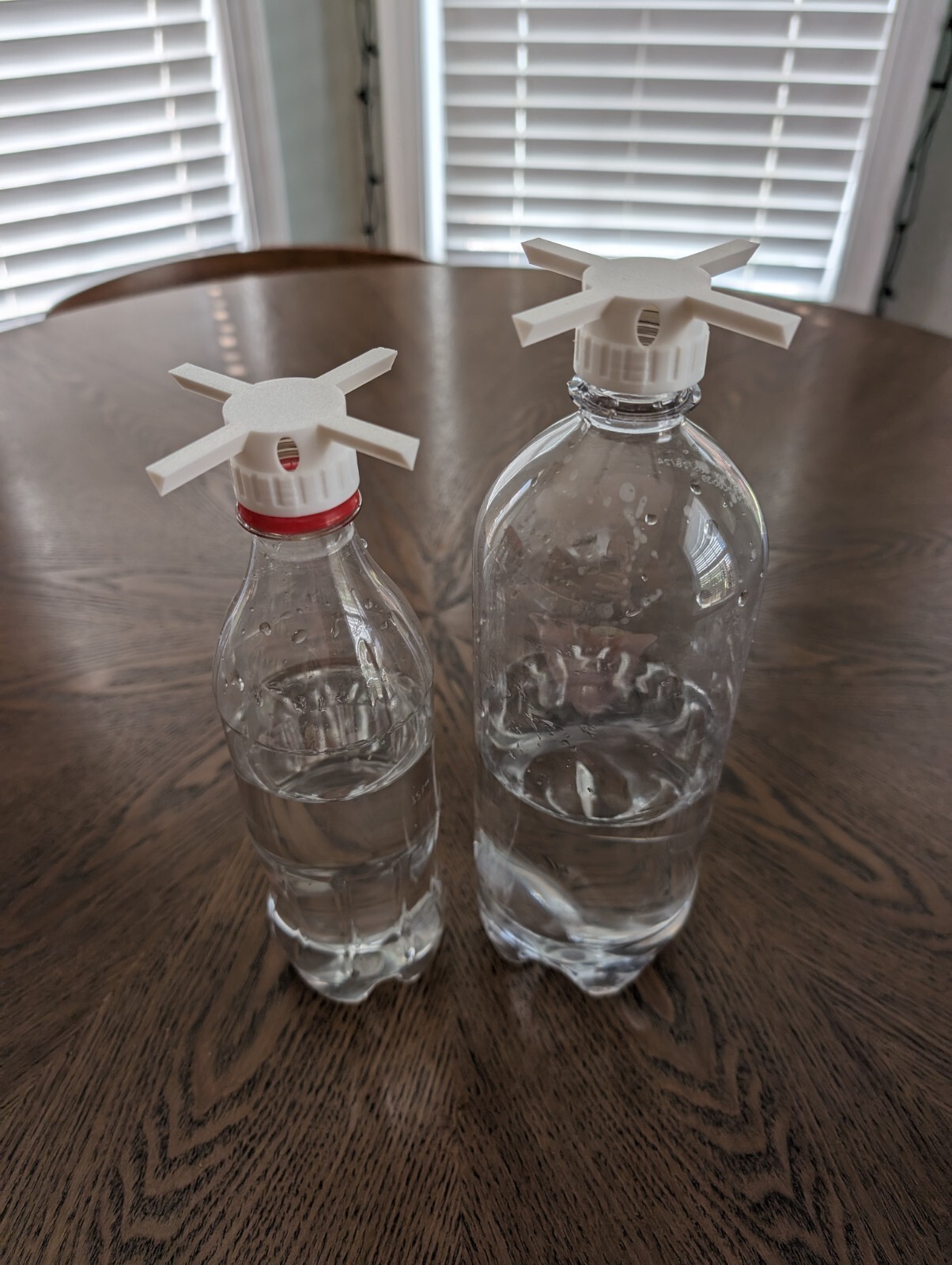 Set of soda bottle adapters for self watering microgreen grower