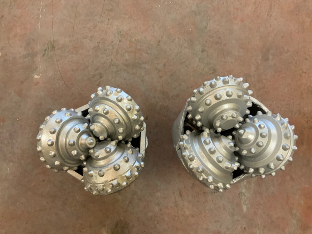 9 7/8 TCI button bits. Reverse circulation. Bored center hole. Hughes