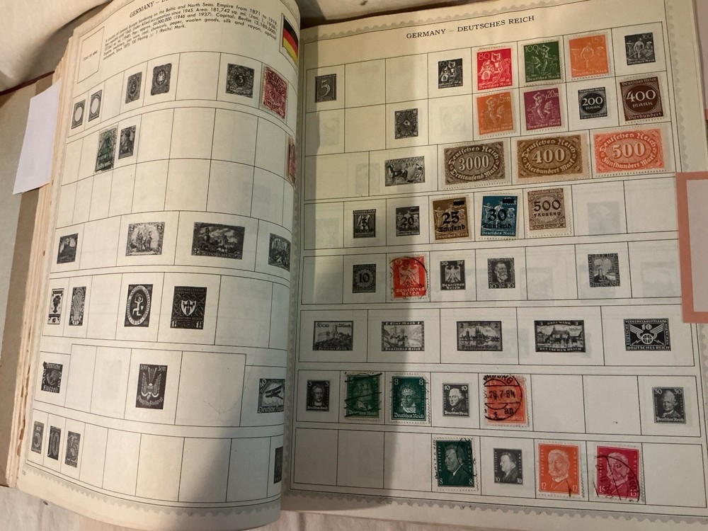 The New World Wide Postage Stamp Album with Over 775 Stamps See Photos