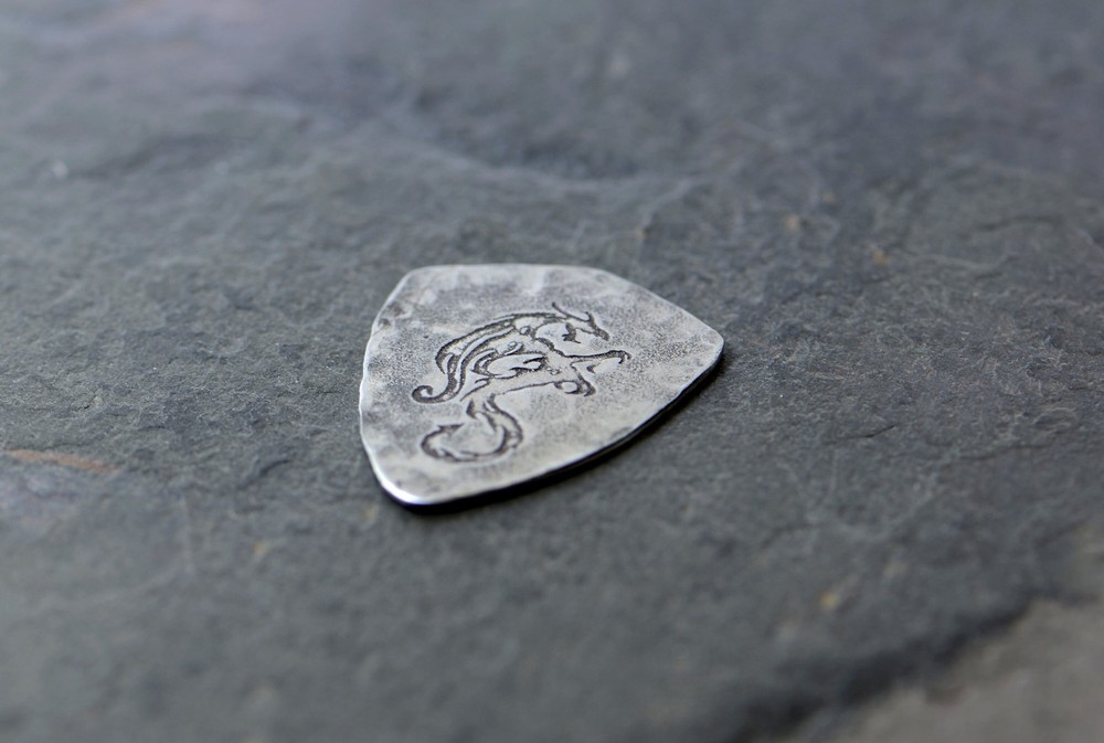 Sterling silver dragon guitar pick in shield shape
