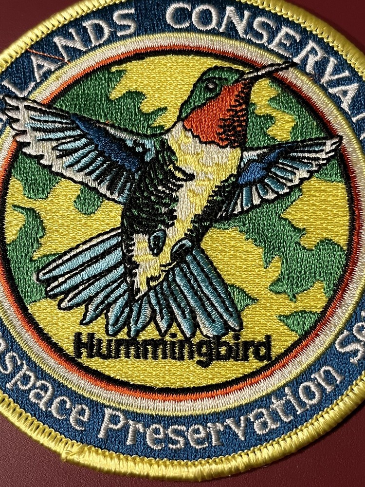 2004 WILDLANDS CONSERVANCY PATCH 4" DIAMETER "HUMMINGBIRD"