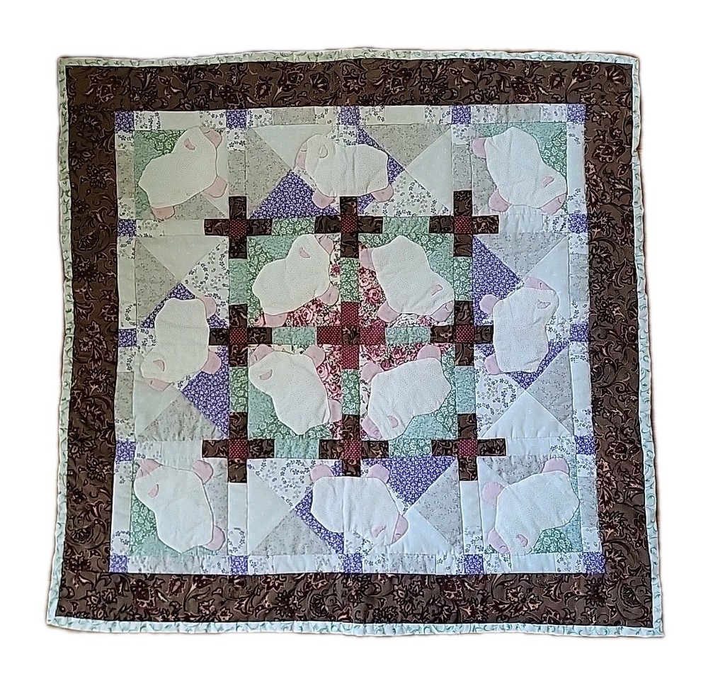 Handmade small quilt with a lamb appliqué pattern. 29"×29" Signed