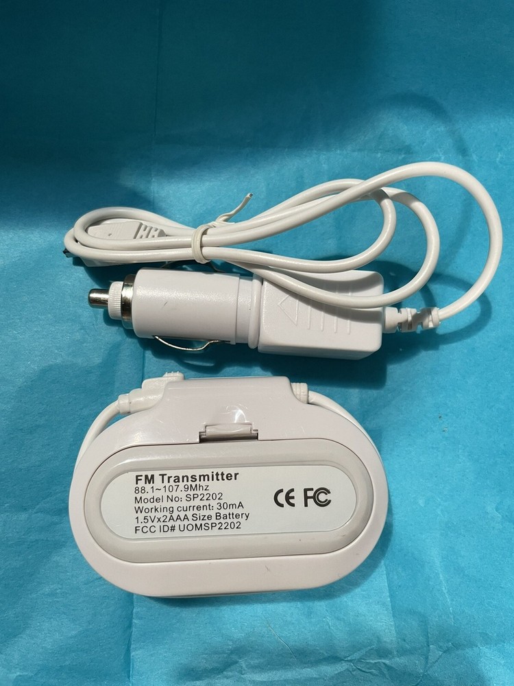 In Car FM Transmitter w Charger Model SP2202