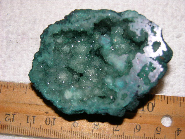 Geode cut & polished half with colored crystal center 2.5 inch E63