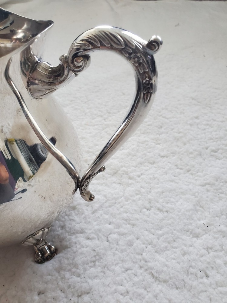 Cheeks Design &Art co. Silver plated footed pitcher