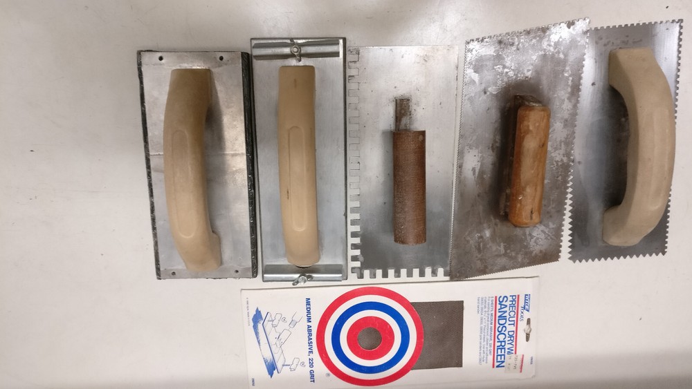 Eight assorted drywall/mud tools