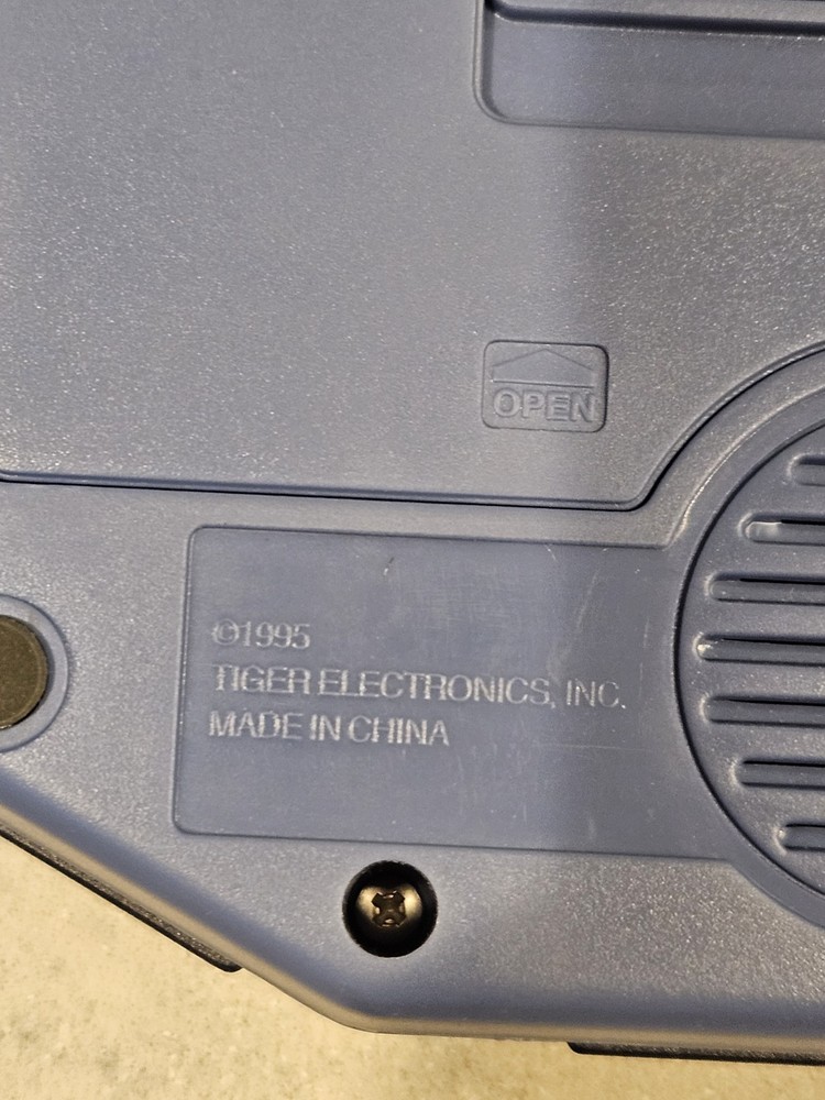 Tiger Electronics Jeopardy Hand Held Game 1995 with Answer Question Book