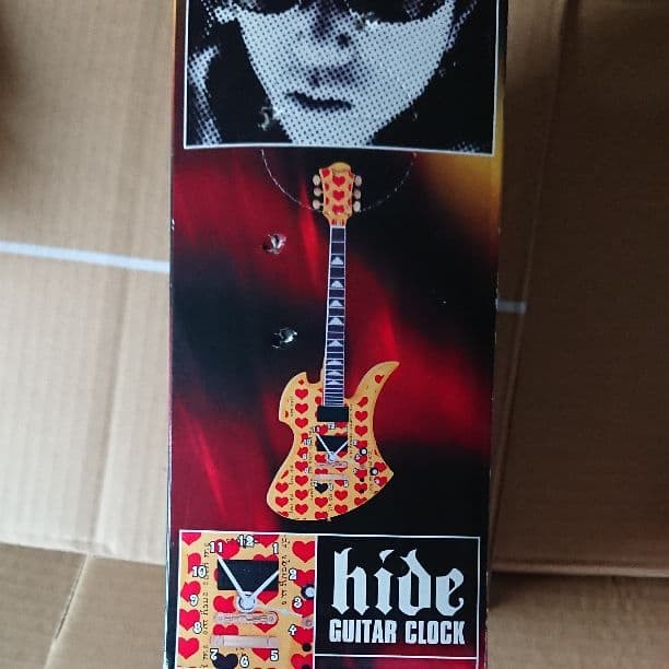 hide guitar shaped wall clock