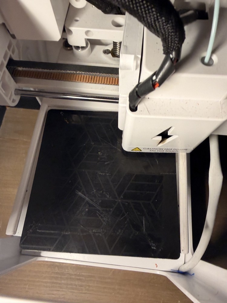 toybox 3d printer alpha 2 with power cable and accessories.