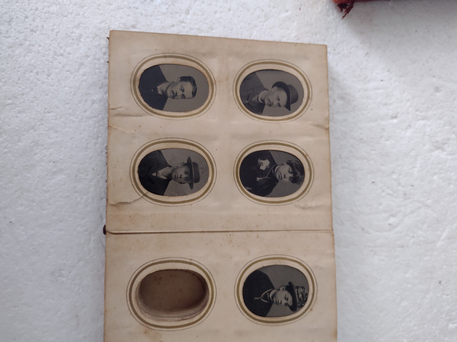 Tintype portraits in two old L;eather Albums 4x4x1