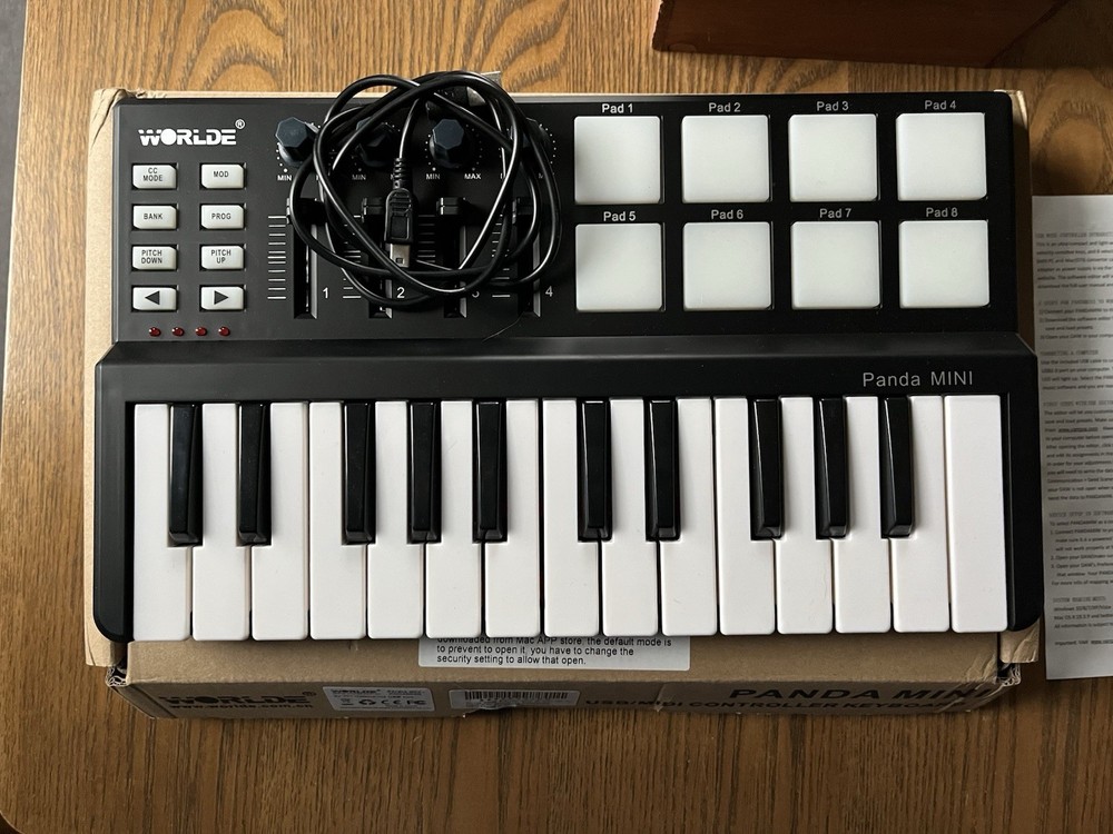 WORLDE Panda MINI 25-Key USB/MIDI Keyboard Controller Pad Triggers Faders Knobs