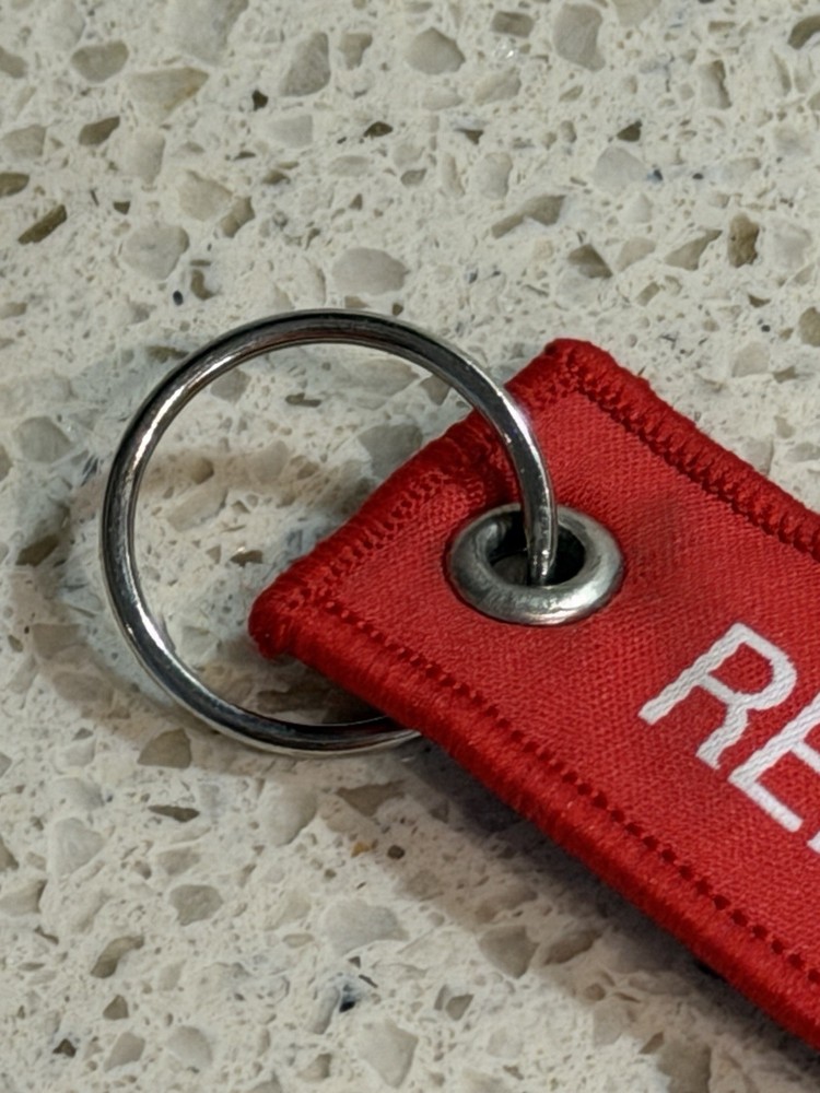 Pre-Owned Red SpaceX Falcon 9 Rocket Remove Before Flight Keychain Zipper Pull